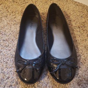 Black flat with patent toe and bow detail